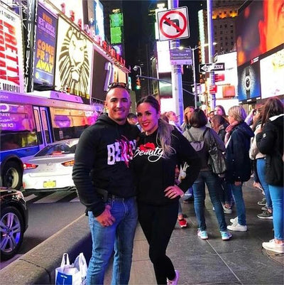 Couple wearing couples' black hoodies